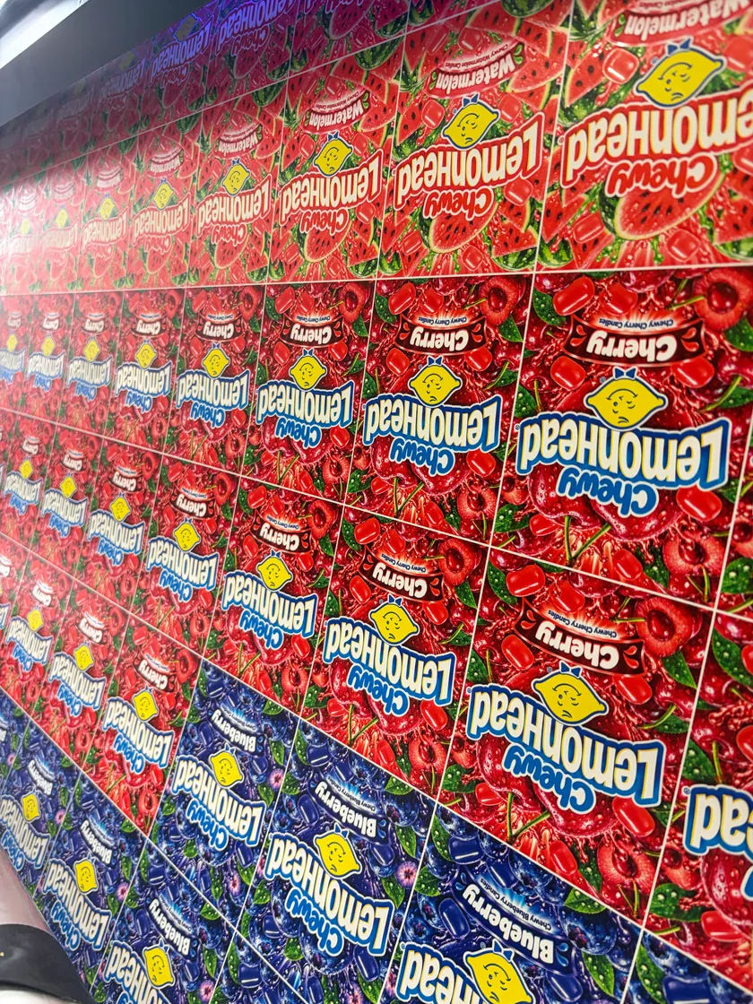Red and green fruit themed printed packaging in rows